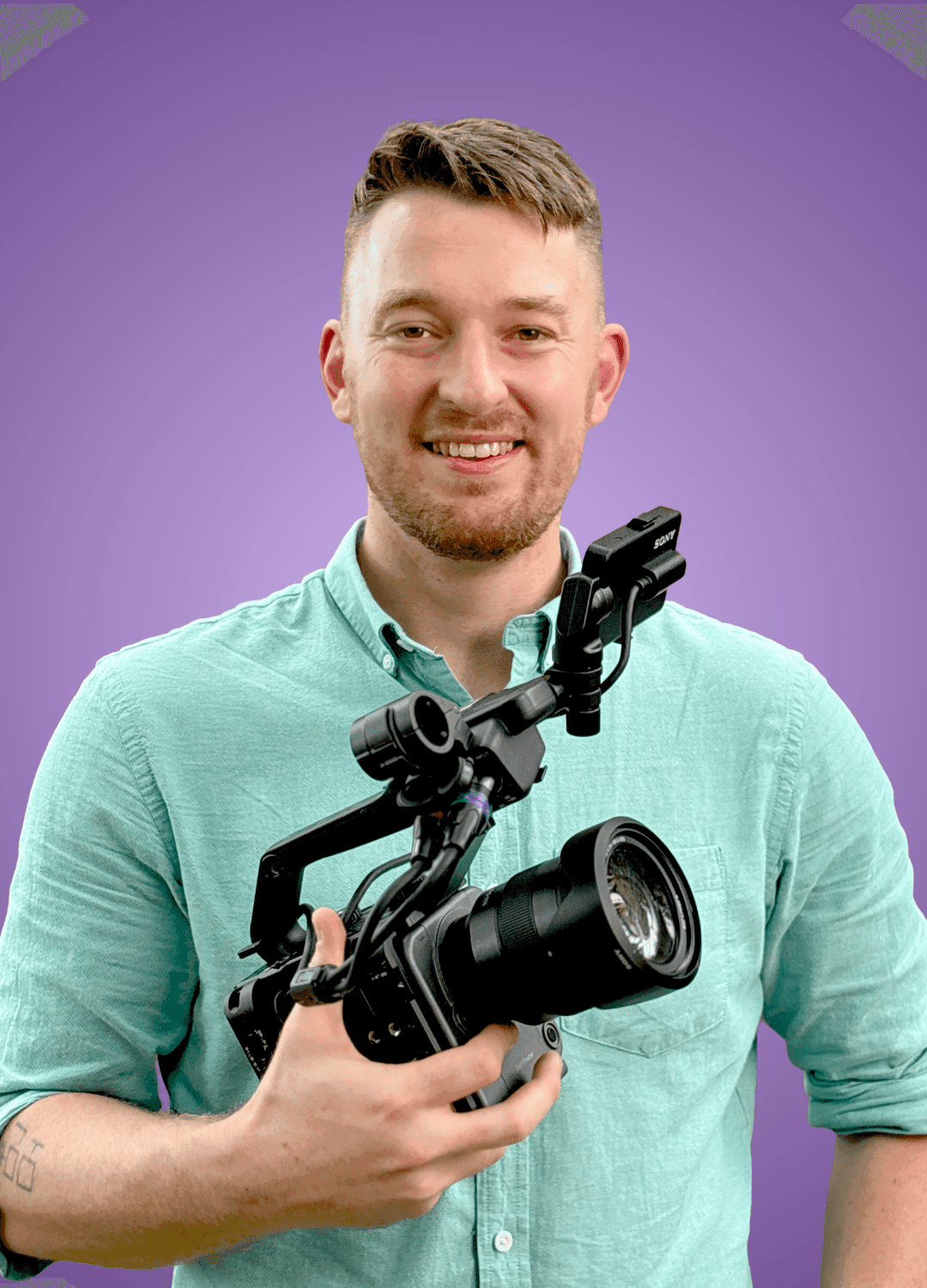 Jackson Tritt, founder of JTX Media, holding a cinema camera